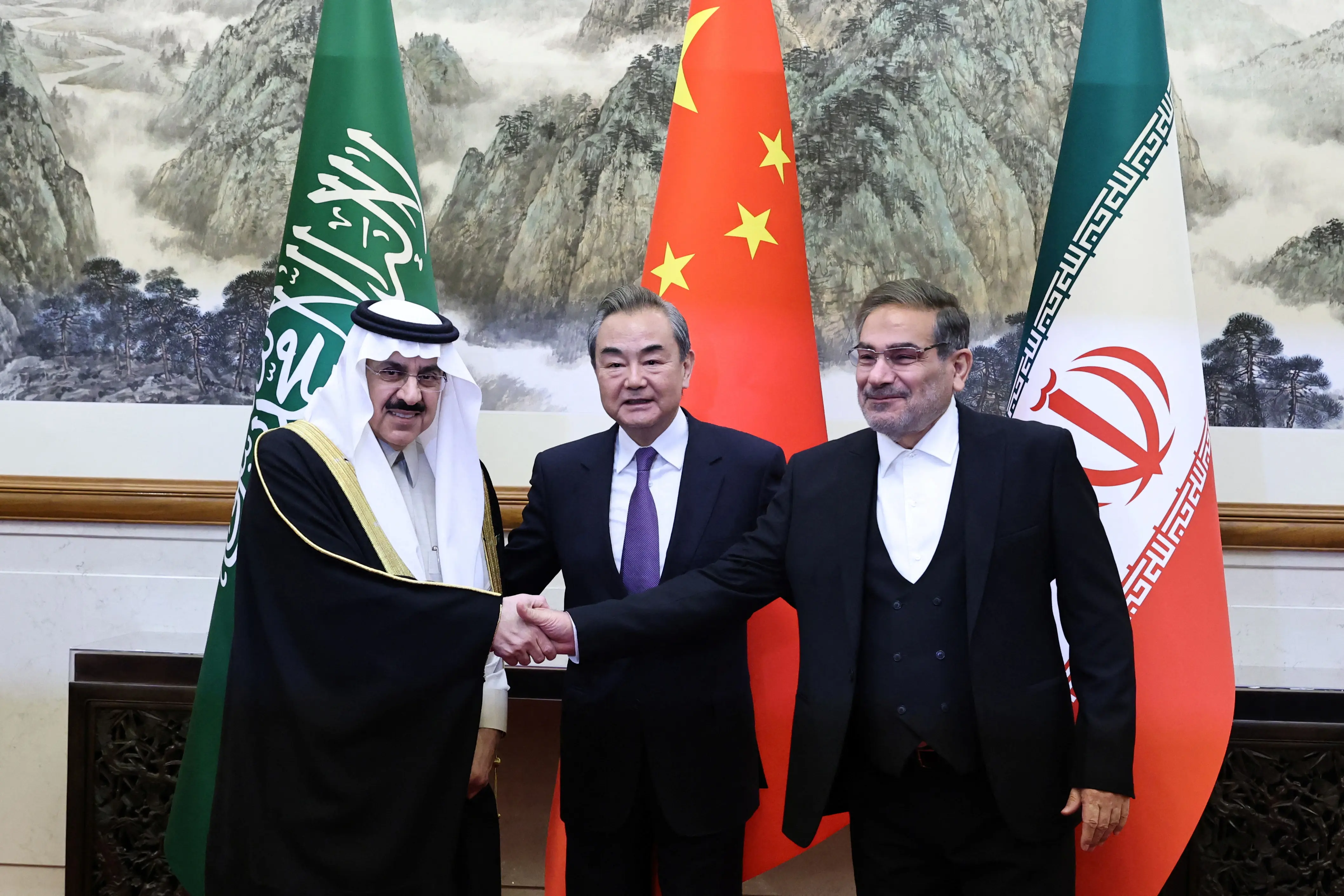 Wang Yi of the Communist Party of China_ Ali Shamkhani_ of Iran_ Saudi Arabia_s Musaad bin Mohammed Al Aiban pose in Beijing_ China_ 10 March 2023 (AFP)